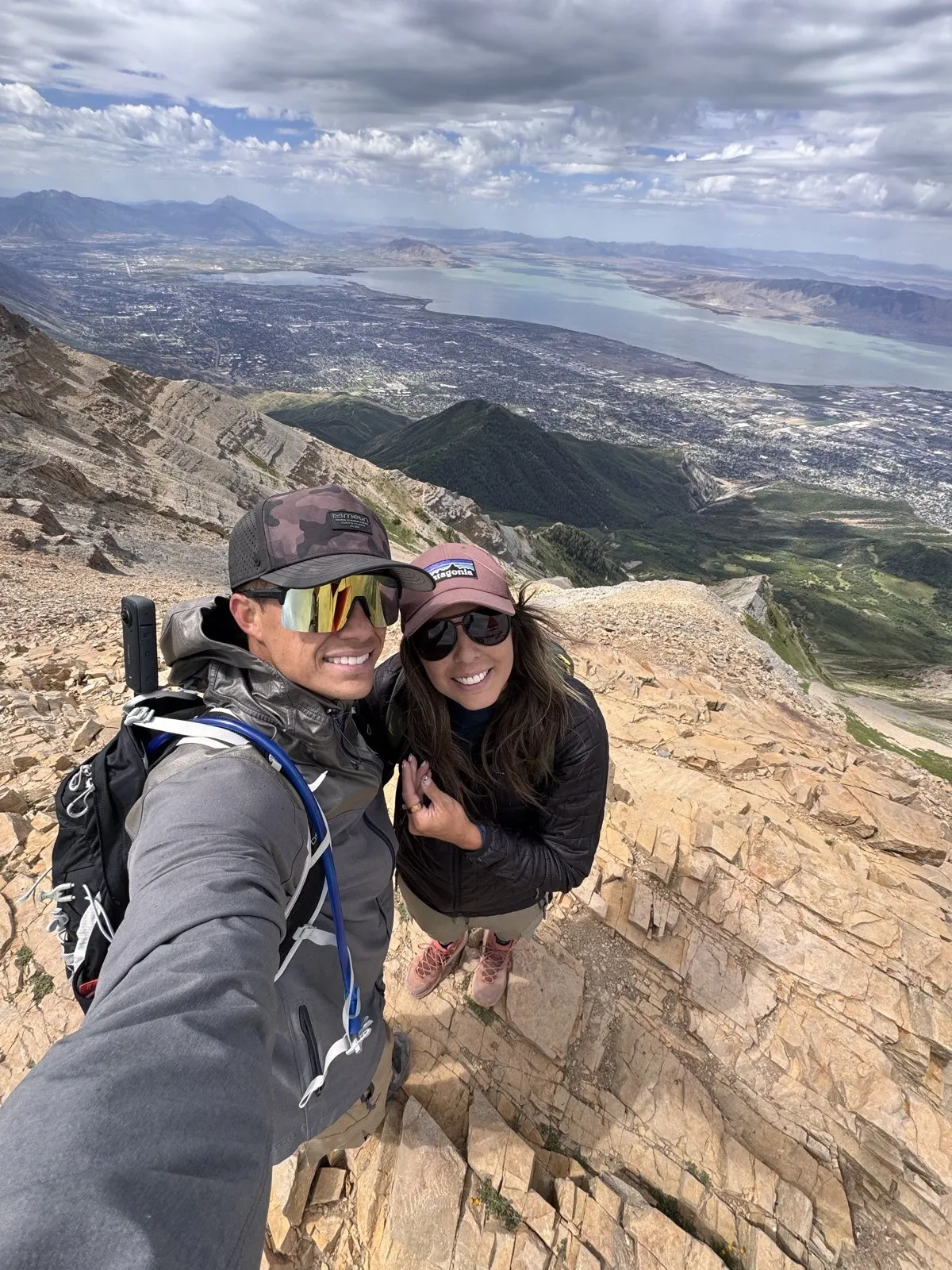 Andy and his wife on a mountain summit above Utah Lake