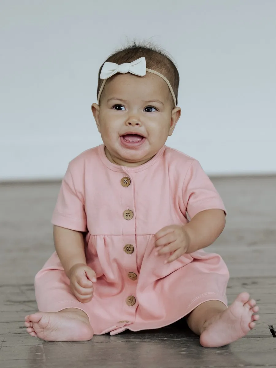 A child in the BRIN Penelope Dress, Rose, from BRIN's launch photoshoot